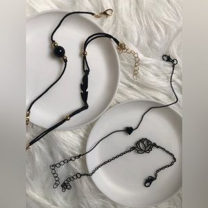 Four black minimalist adjustable bracelets